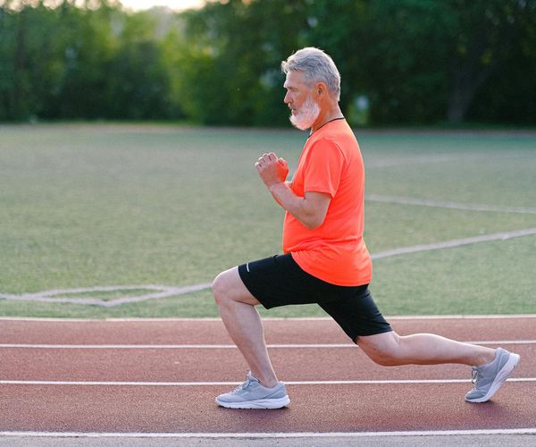 Focused man in sportswear planning his workout routine.